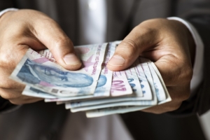 Man Giving Turkish Currency